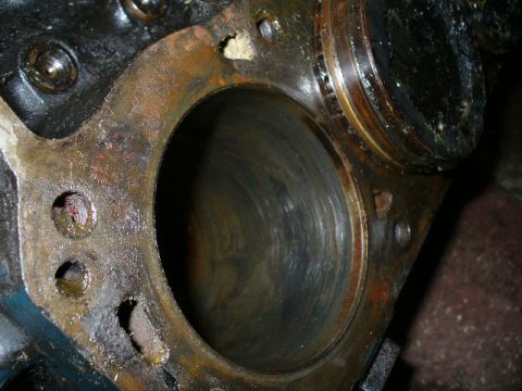 1991 Ford Bronco - This image shows a close-up view of a worn engine cylinder block, indicating potential internal engine damage.