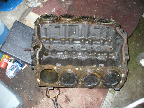 1991 Ford Bronco - A disassembled engine block with pistons is shown, indicating a repair or rebuild process.