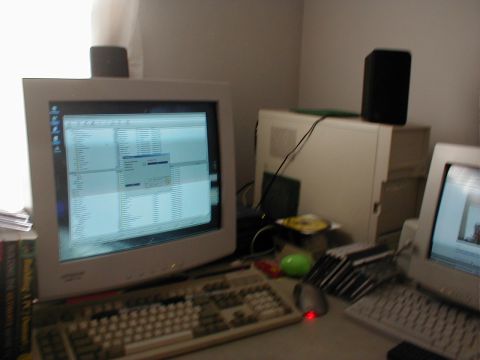 1999 Ford Crown Victoria - A desktop computer setup with a CRT monitor, keyboard, and tower is visible on a desk.
