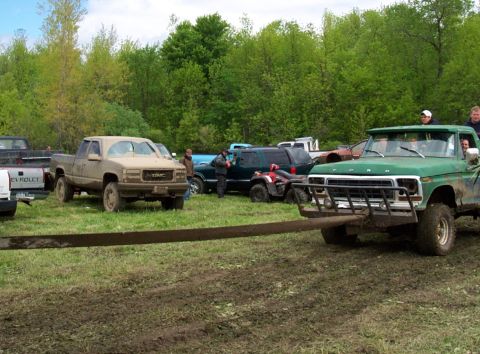 1978 Ford Bronco - A green 1978 Ford truck is seen from the front, equipped with a heavy-duty metal bar attached to its bumper.