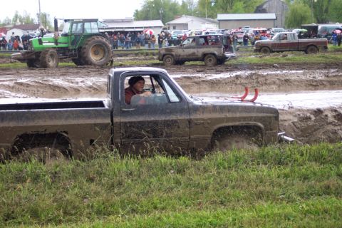 1978 Ford Bronco - Mud bogging event with multiple vehicles stuck in the mud.