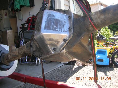 1996 Ford Bronco - A differential axle assembly is shown, suspended by straps, with a date stamp of 09.11.2006.