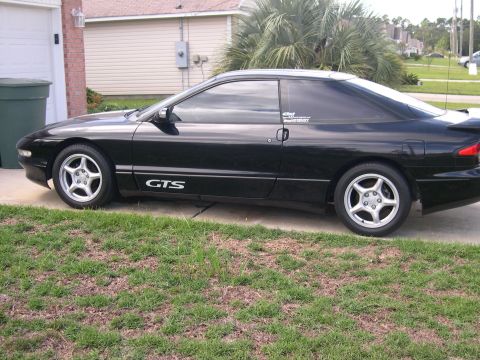 1997 Ford Probe - Side view of a black 1997 Ford Probe GTS with aftermarket wheels.