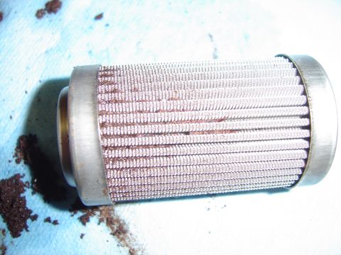 1978 Ford Bronco - This is a used fuel filter, likely needing replacement due to accumulated debris.