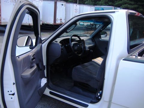 2002 Ford F-150 - Interior view of a 2002 Ford F-150 pickup truck, showing the driver's side.