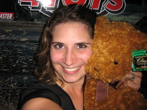 1995 Ford Bronco - A woman smiles while holding a teddy bear with a "Classic Impressions" tag visible on its ear.