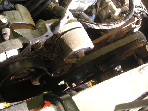 1999 Jeep Grand Cherokee - Close-up view of the engine's belt and pulley system.