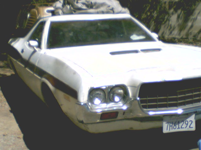 White 1972 Ford Ranchero, front 3/4 view, hood scoops and plate 7H61292