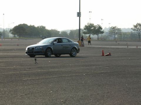 2001 Mercury Grand Marquis - An Audi A4 sedan navigates a course marked by traffic cones on a sunny day.