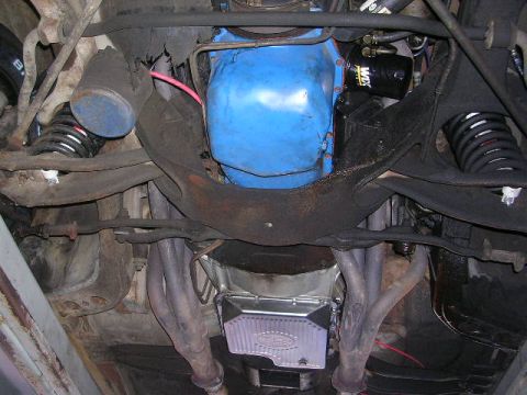1975 Ford Ranchero - The undercarriage of a vehicle reveals its engine, transmission, and suspension systems.
