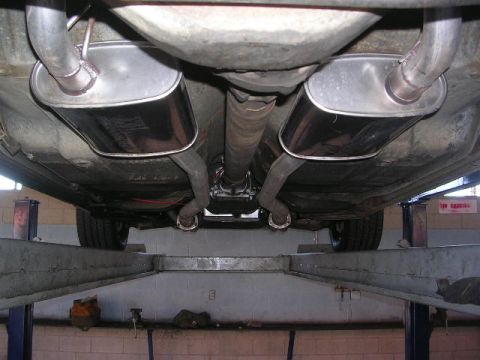 1975 Ford Ranchero - Undercarriage view of a vehicle, focusing on the dual exhaust system.