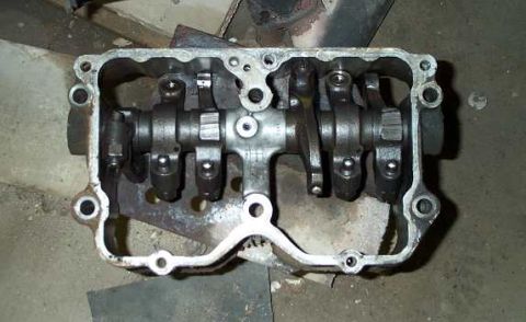 1994 Ford F-150 - This is a close-up view of an engine's valve train assembly, showing the rocker arms and camshaft mechanism.