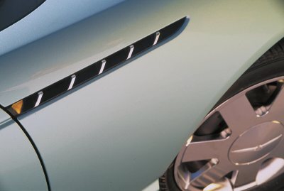 2002 Ford Thunderbird - Close-up of the side fender vent and chrome wheel on a 2002 Ford Thunderbird.