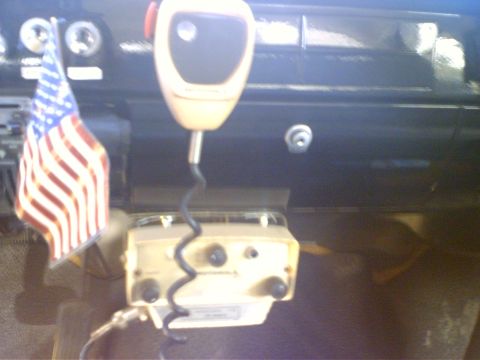 1991 Ford Crown Victoria - Interior view of a vehicle's dashboard a CB radio and microphone.