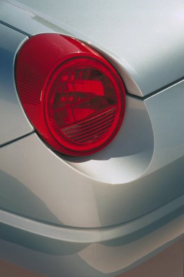 2002 Ford Thunderbird - The distinctive round taillight of a 2002 Ford Thunderbird is visible from the rear.