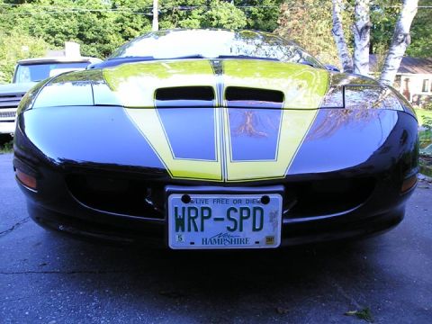 1994 Pontiac Trans Am - Front view of a 1994 Pontiac Trans Am with yellow racing stripes and a custom license plate.