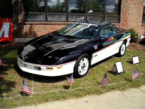 1994 Pontiac Trans Am - This 1994 Chevrolet Camaro Z28 Pace Car features distinctive graphics and is displayed with American flags.