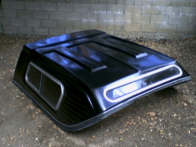 Black truck cab-high fiberglass tonneau or bed cover with window