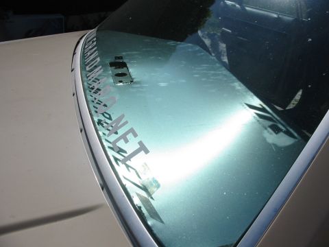 1985 Ford LTD Crown Victoria - The windshield displays a decal and a website logo, with no visible year identification.