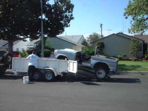 1966 Ford Bronco - A disassembled 1966 Ford Bronco body is being transported on a trailer.