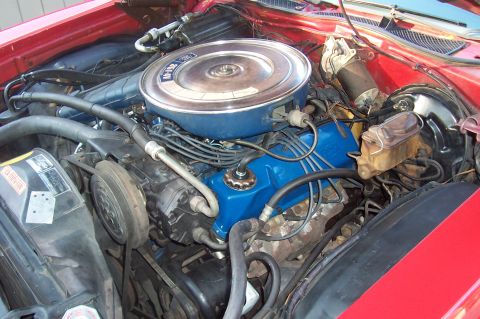 1973 Ford Ranchero - The engine bay of a 1973 Ford Ranchero, blue valve covers and a chrome air cleaner assembly.