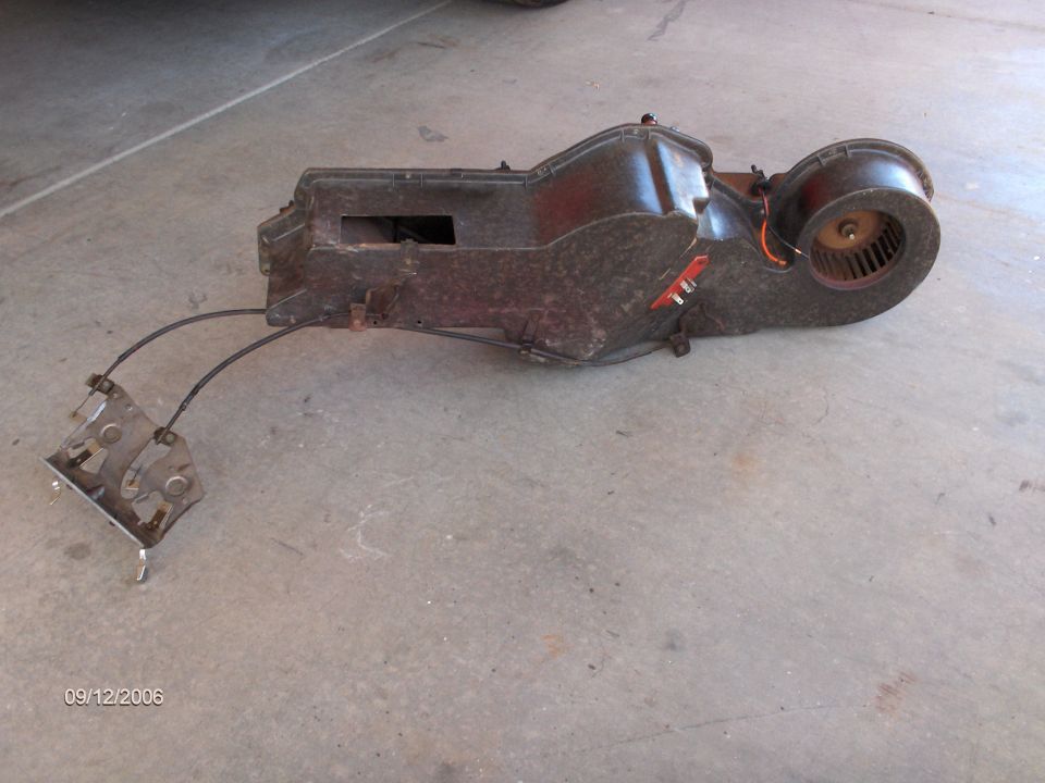 The heater plenum which houses the heater blower motor and the heater core. After the new parts arrived, I reassembled the plenum and Bob repainted it.