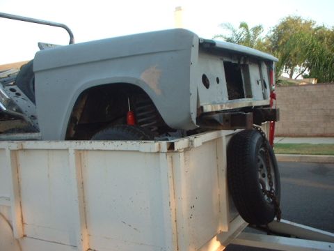 1966 Ford Bronco - A bare early Ford Bronco body tub and front clip, stripped of paint to primer and missing doors, glass and drivetrain, loaded in the bed of…