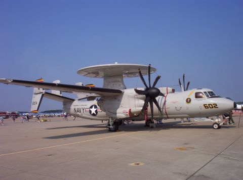 2003 Ford Crown Victoria - A Grumman E-2 Hawkeye aircraft is on display at an airshow under a clear blue sky.