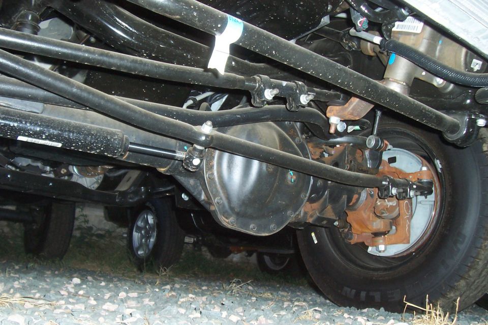 Front axle and suspension components of a truck