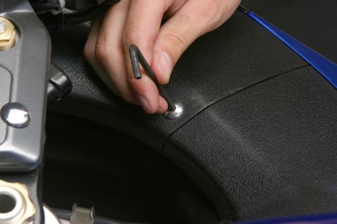 2006 Suzuki Hayabusa 1300 - Start by removing the three Allen screws that hold the lower half of the inner fairing to the bike.