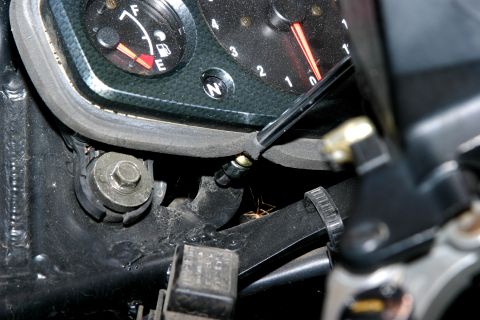 2006 Suzuki Hayabusa 1300 - The stock 'Busa bezel is held on with two Phillips screws along the bottom edge and double sided tape on its back. The screws are located j…