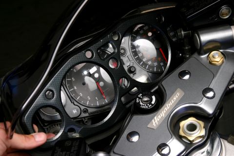 2006 Suzuki Hayabusa 1300 - Since the bezel is still attached by the double-sided tape, you will have to pry it up carefully to avoid damaging the gauge cluster. We we…
