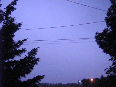 1995 Ford Bronco - Power lines against a twilight sky, with a website logo in the corner.