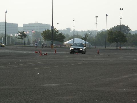 2001 Mercury Grand Marquis - A 2001 Mercury Grand Marquis navigates a cone course in a large parking lot.