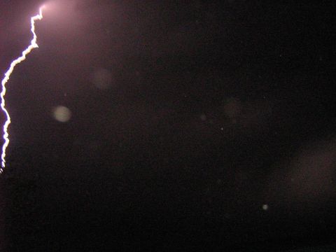 1995 Ford Bronco - Lightning strike captured in a dark sky, with a website watermark visible.
