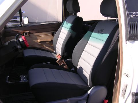 1985 Toyota 4Runner - Interior view of a 1985 Toyota 4Runner, highlighting the custom Wet Okole seat covers.