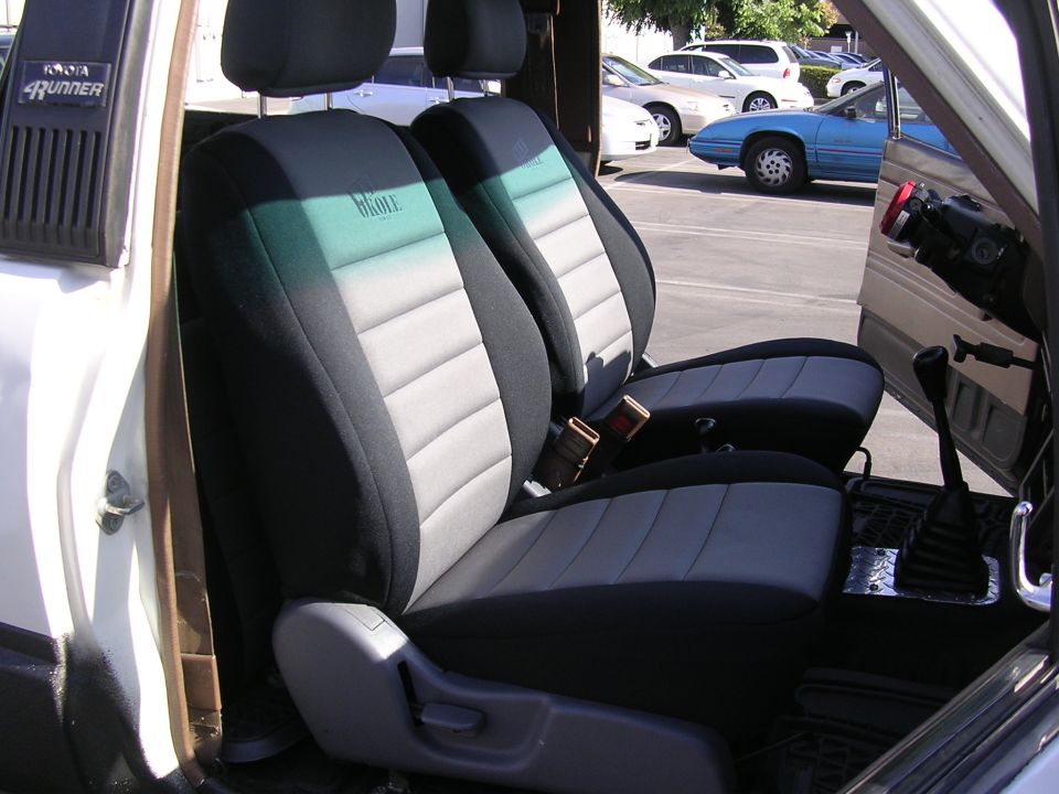 Toyota 4Runner front seats with black, gray, and teal Wet Okole seat covers