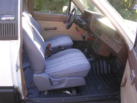 1985 Toyota 4Runner - The interior of a 1985 Toyota 4Runner features cloth seats and a manual transmission.