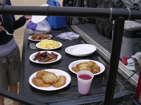 1985 Toyota 4Runner - Tailgate breakfast spread with various food items and a drink.