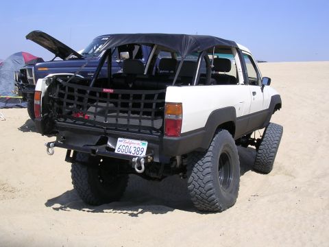 1985 Toyota 4Runner - This modified pickup truck is equipped for off-road adventures on a sandy terrain.
