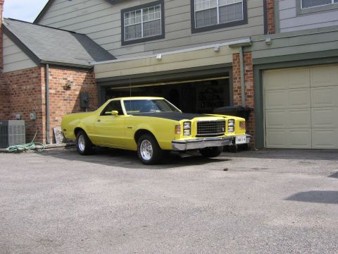 1978 Ford Ranchero - This yellow coupe utility has a distinctive grille and dual headlights, suggesting a 1977 model year.