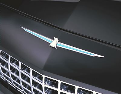 2002 Ford Thunderbird - Close-up of the hood ornament and grille on a 2002 Ford Thunderbird.
