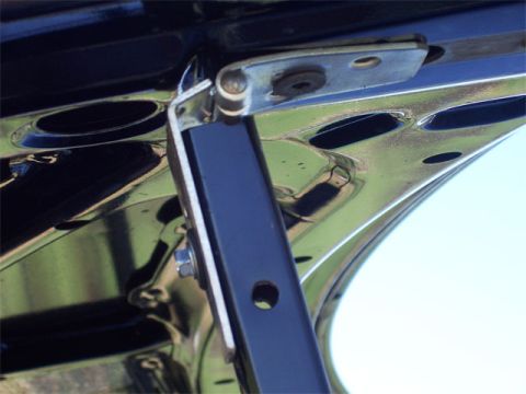 1998 Dodge Avenger - This photo shows the underside of a trunk lid with its hinge and support strut mechanism visible.