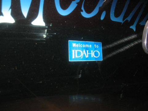 1979 Ford Bronco - A sticker reading 'Welcome to IDAHO' is affixed to the dark surface of a vehicle.
