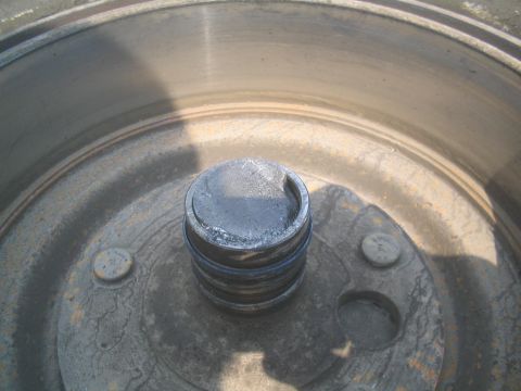 1979 Ford Bronco - Close-up of a vehicle's wheel hub and brake drum, showing wear and tear.