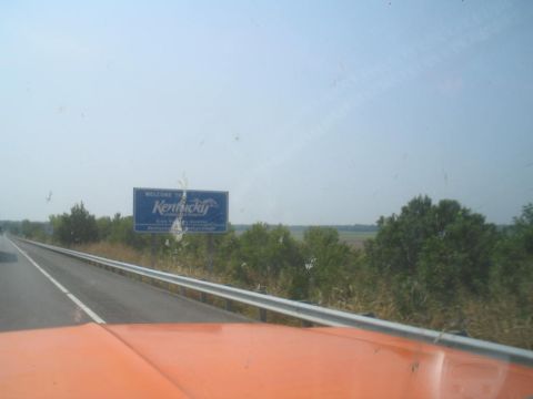 1979 Ford Bronco - Driving into Kentucky, passing the state welcome sign on a clear day.