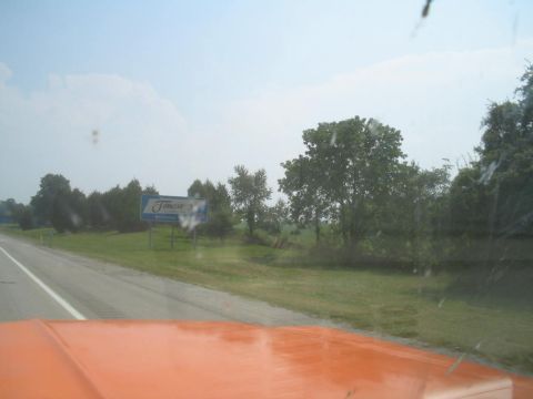 1979 Ford Bronco - A sign for Jamestown is visible from the road, seen from the perspective of a vehicle's interior.