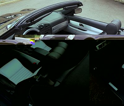 2002 Ford Thunderbird - The interior of a 2002 Ford Thunderbird convertible is visible from a side angle with the soft top up.