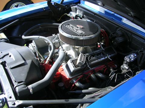 1996 Ford Probe - Close-up of a V8 engine bay, Edelbrock components and a prominent air filter.