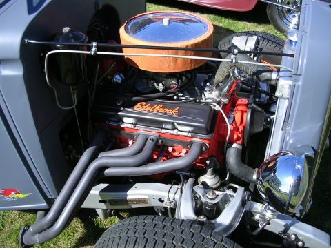 1996 Ford Probe - Close-up of a modified engine bay, showing custom parts and a cartoon bird sticker on the fender.